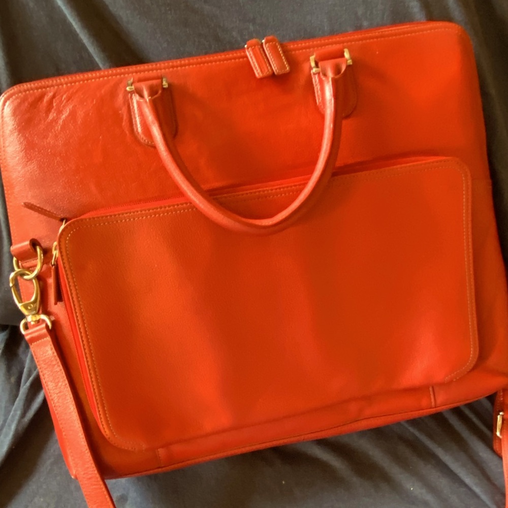 . Make a statement in red!  Beautiful Levenger briefcase like new condition.